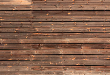 horizontal wooden boards tinted in brown color