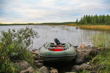 Rubber motor boat at the lake shore