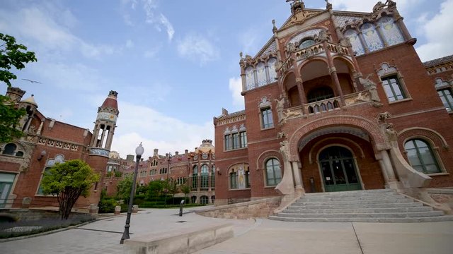 BARCELONA, SPAIN - MAY 2018: People visit Recinte Modernista de Sant Pau. The city attracts 15 million tourists annually