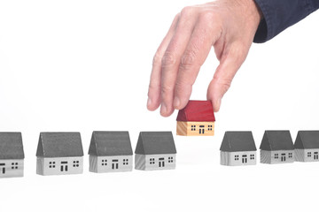 real estate concept: toy house isolated on white background with copy space