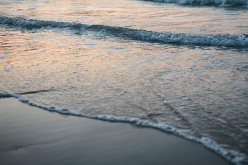 sunset reflects on the beach