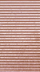 horizontal stripes on a brown fence