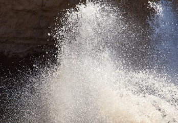 Splashes of dirty water on the surface of the river