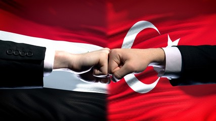 Syria vs Turkey conflict, international relations, fists on flag background