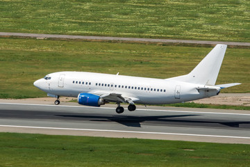 Modern passenger airplane landing at international airport