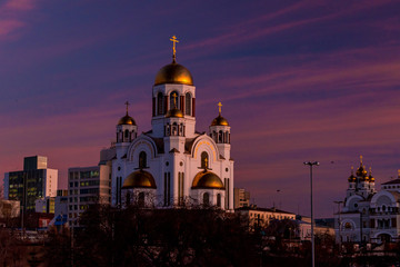 Fototapeta na wymiar View of church of All Saints, Yekaterinburg, Russia at evening with purple sky