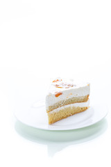a piece of homemade sweet cake with cream and canned apricots