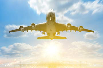 Airplane takeoff to the sunrise sky