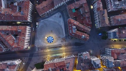 Amazing evening view of a children's carousel in Montpellier France. Aerial drone overhead view