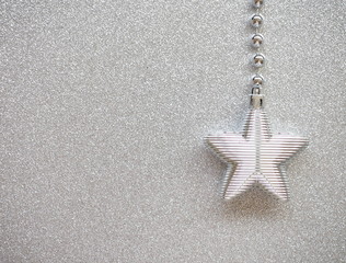 Christmas shining decoration - star on silver background