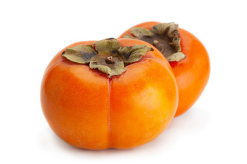 Persimmon fruit closeup on white