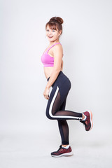Obraz premium woman wearing sportswear show her body