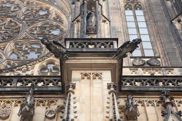 Fototapeta na wymiar Scary gargoyles of Saint Vitus Cathedral in Prague, original gothic style sculpture