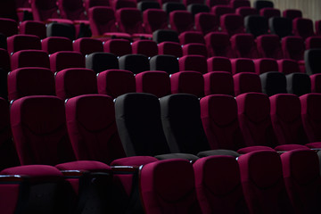 empty red chairs in theaters