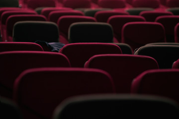 Fototapeta premium abstract red cinema seats in dark tone