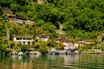 Fototapeta na wymiar waterfront view village on Lake Lugano. Switzerland