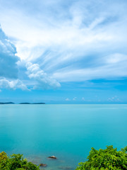 Seascape view under cloudy blue sky