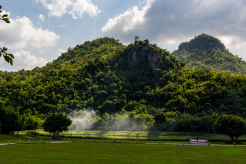 hills of grren jungle an grey smoke