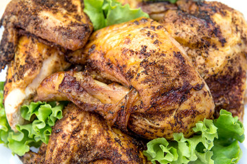 Dish with pieces of grilled chicken with salad