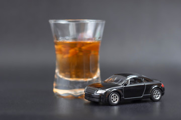 model car with alcohol whiskey. concept for drinking and driving.