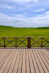 Fototapeta na wymiar wooden fence on the field background