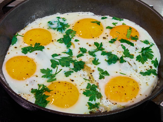 scrambled eggs on a cast iron pan