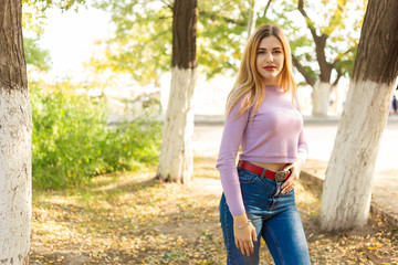 Autumn woman portrait outdoors at the park