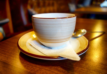 Coffee cup on the table in caffe.