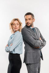 professional business colleagues standing with crossed arms and looking at each other isolated on white