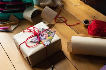 Gift box on table at home
