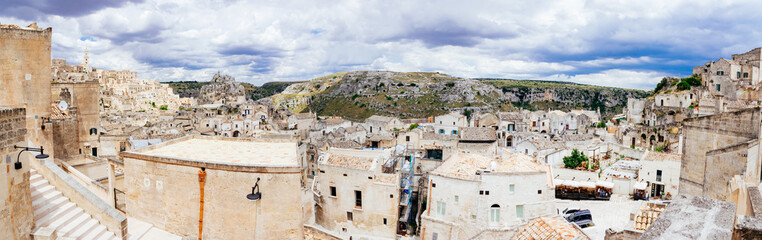 Scenic panorama of ancient cave dwellings in Matera's Sasso Caveoso and Murgia National Park, Basilicata, Italy