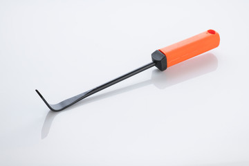 Gardening Tools: Close up of a Cape Cod Weeder Isolated on White Background Shot in Studio.