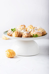 Delicious profiteroles with cream