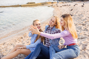 Fototapeta na wymiar A picture of a group of women having fun on the beach