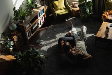 Couple sleeping on floor in living room