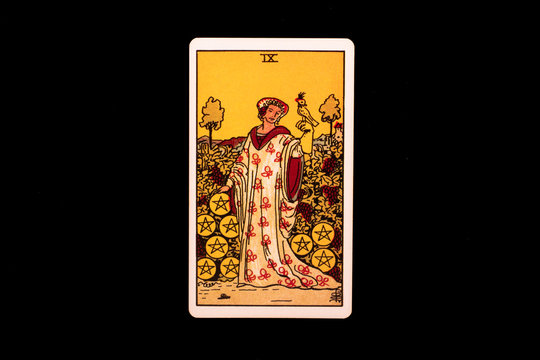 An individual minor arcana tarot card isolated on black background. Nine of pentacles.
