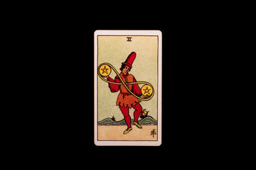 An individual minor arcana tarot card isolated on black background. Two of pentacles.