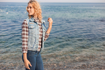 A young girl spends time on the coast