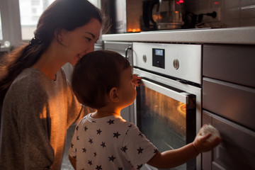 young multiethnic family making a cake together