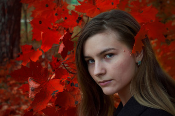 woman in autumn leaves