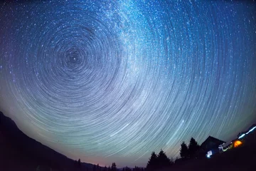 Fotobehang movement of stars in the sky © panaramka