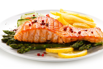 Grilled salmon, French fries and vegetables