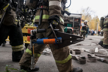 Firefighters work on an extrication using a hydraulic rescue tool
