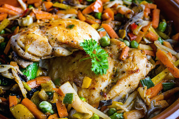 Fried chicken fillet with vegetables.