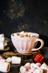 Obraz na płótnie Canvas Good New Year spirit. Coffee with marshmallows and cinnamon. Pink mug. Cooking yourself. Photos for coffee. Home comfort. New Year. Christmas time. Winter mood.