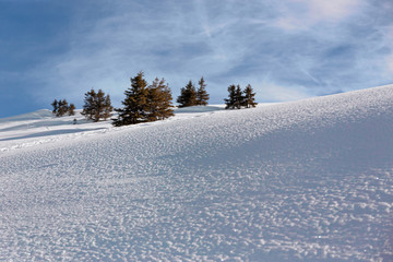 Panoramic view of the snow-covered Alps in winter, in the canton of Graubünden in Switzerland.