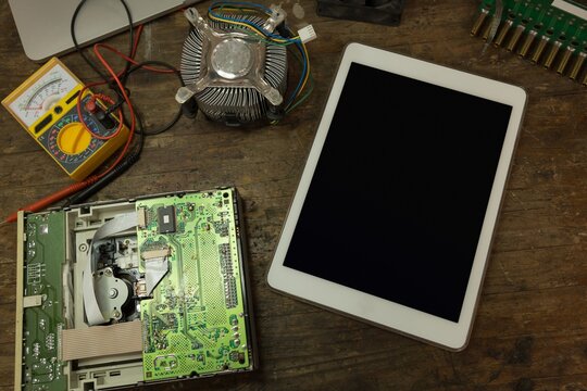 Digital tablet and circuit board on table