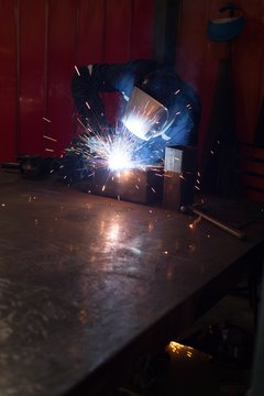Robotic engineers using welding torch