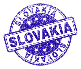 SLOVAKIA stamp seal watermark with grunge style. Designed with rounded rectangles and circles. Blue vector rubber print of SLOVAKIA text with grunge texture.