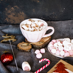 Fototapeta na wymiar Good New Year spirit. Coffee with marshmallows and cinnamon. Pink mug. Cooking yourself.Home comfort. New Year. Christmas time. Winter mood.Letter to Santa Claus. To Do list.New Year resolution
